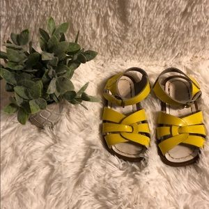 Used yellow salt water sandal